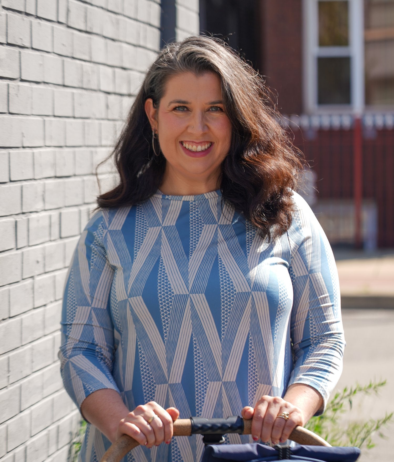 Pushing Bumbleride Era wearing blue Manaola Hawaii dress in Pilsen Chicago